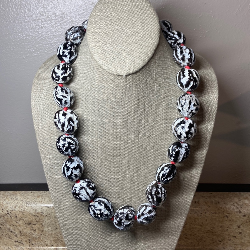 Carved Kukui nut necklace